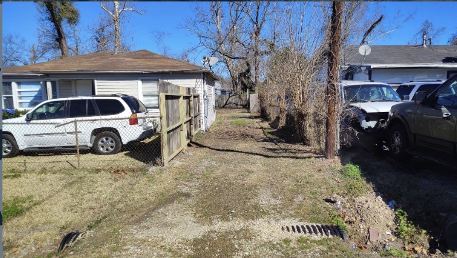 7509 Touchstone Street, Unit B Houston, TX 77028 - Photo 10 of 10 a front view of a house with a yard