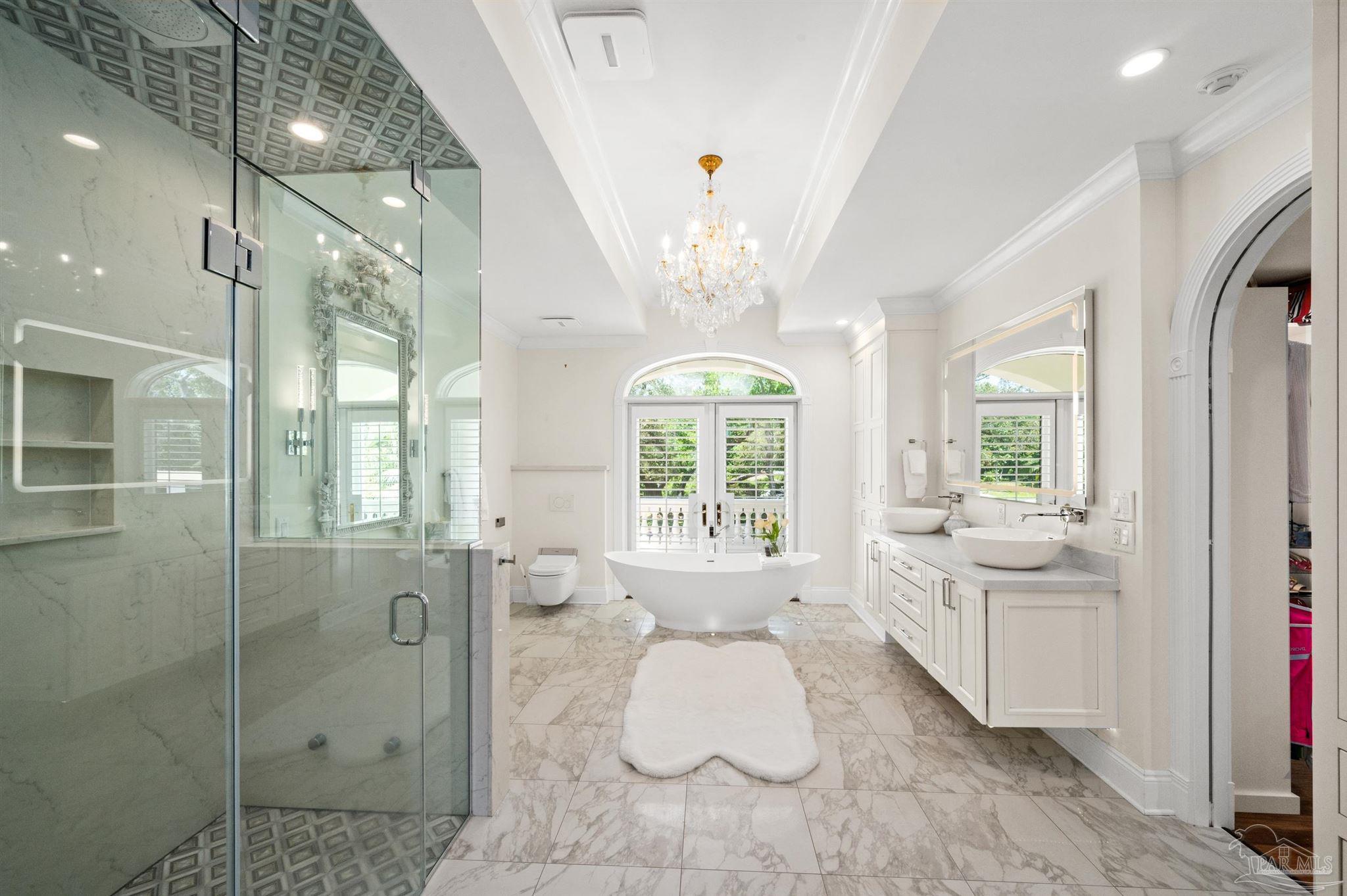 29416 Canal Road Orange Beach, AL 36561 - Photo 23 of 50 a bathroom with a balcony a bathtub and a shower