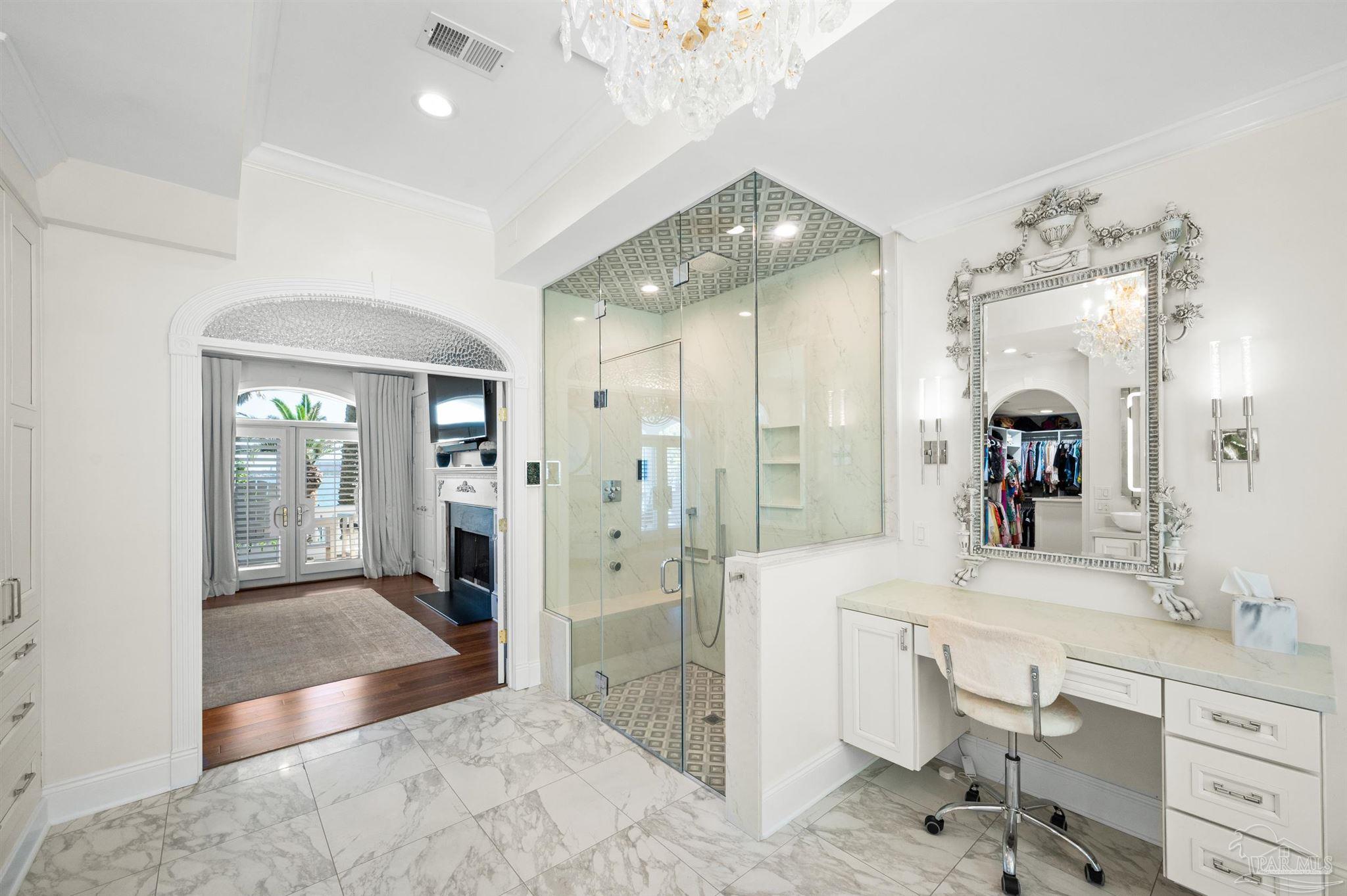 29416 Canal Road Orange Beach, AL 36561 - Photo 24 of 50 a spacious bathroom with a shower sink and mirror