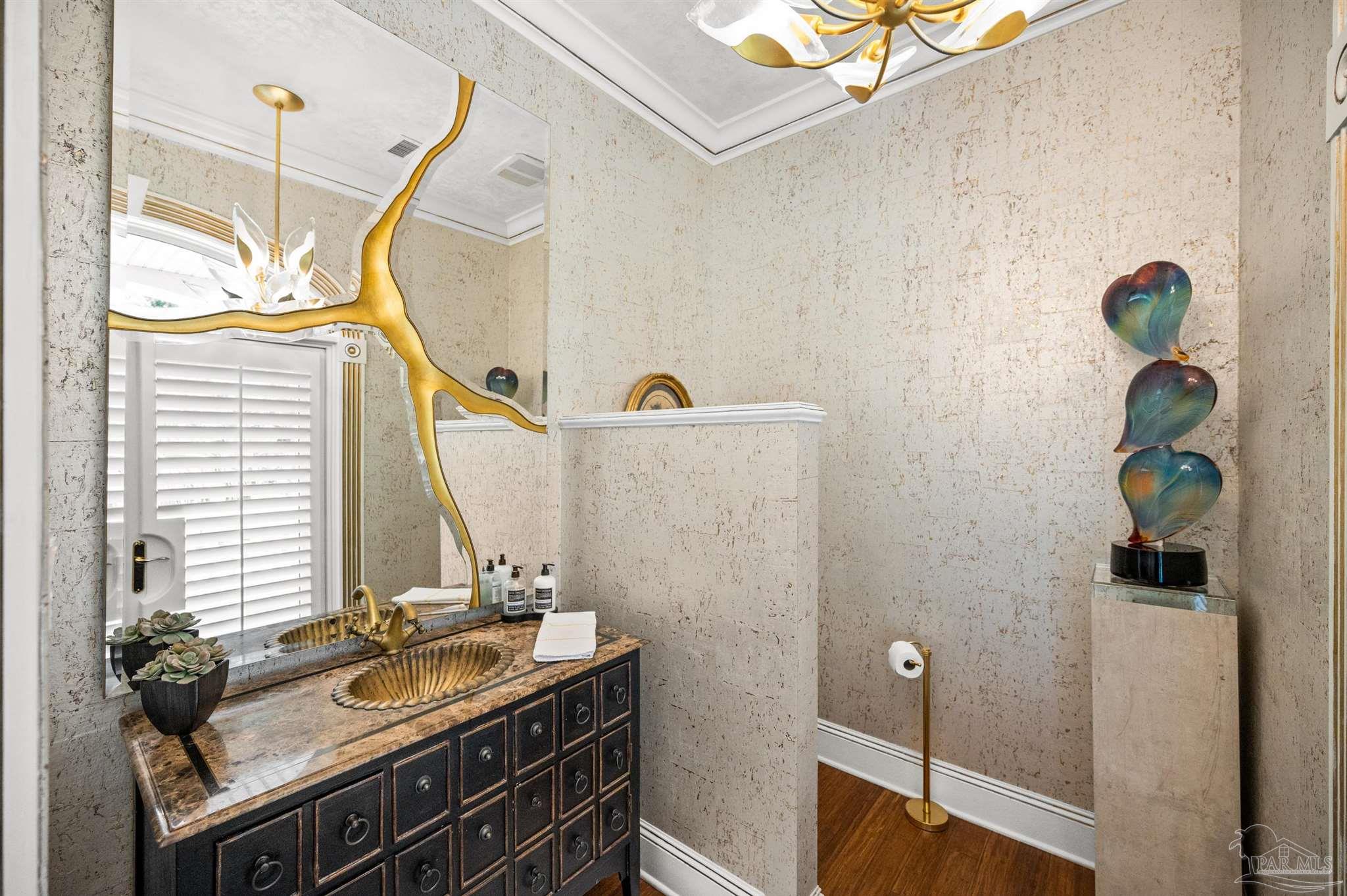 29416 Canal Road Orange Beach, AL 36561 - Photo 27 of 50 a bathroom with a sink and a mirror