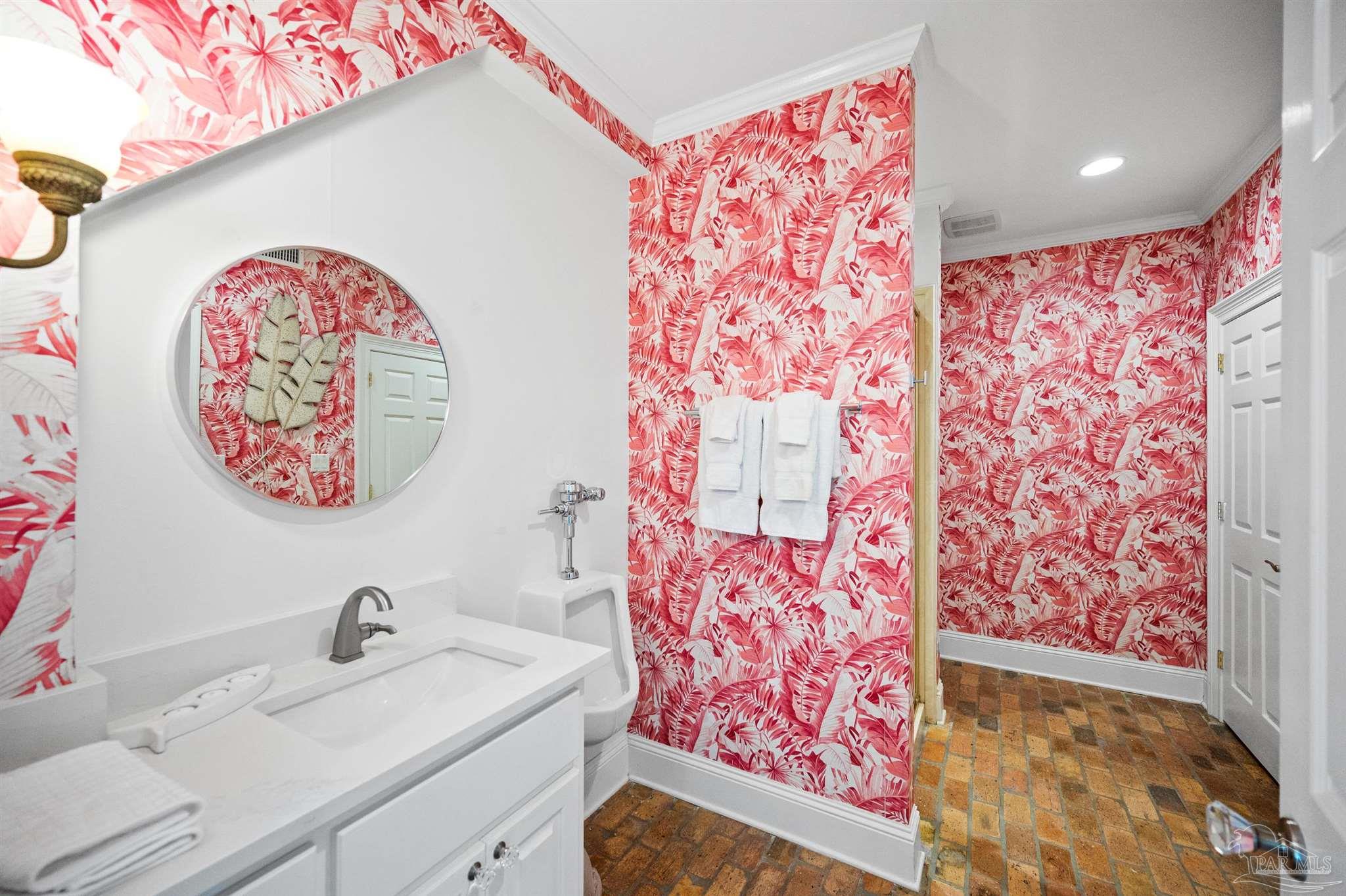 29416 Canal Road Orange Beach, AL 36561 - Photo 31 of 50 a bathroom with a sink and a mirror
