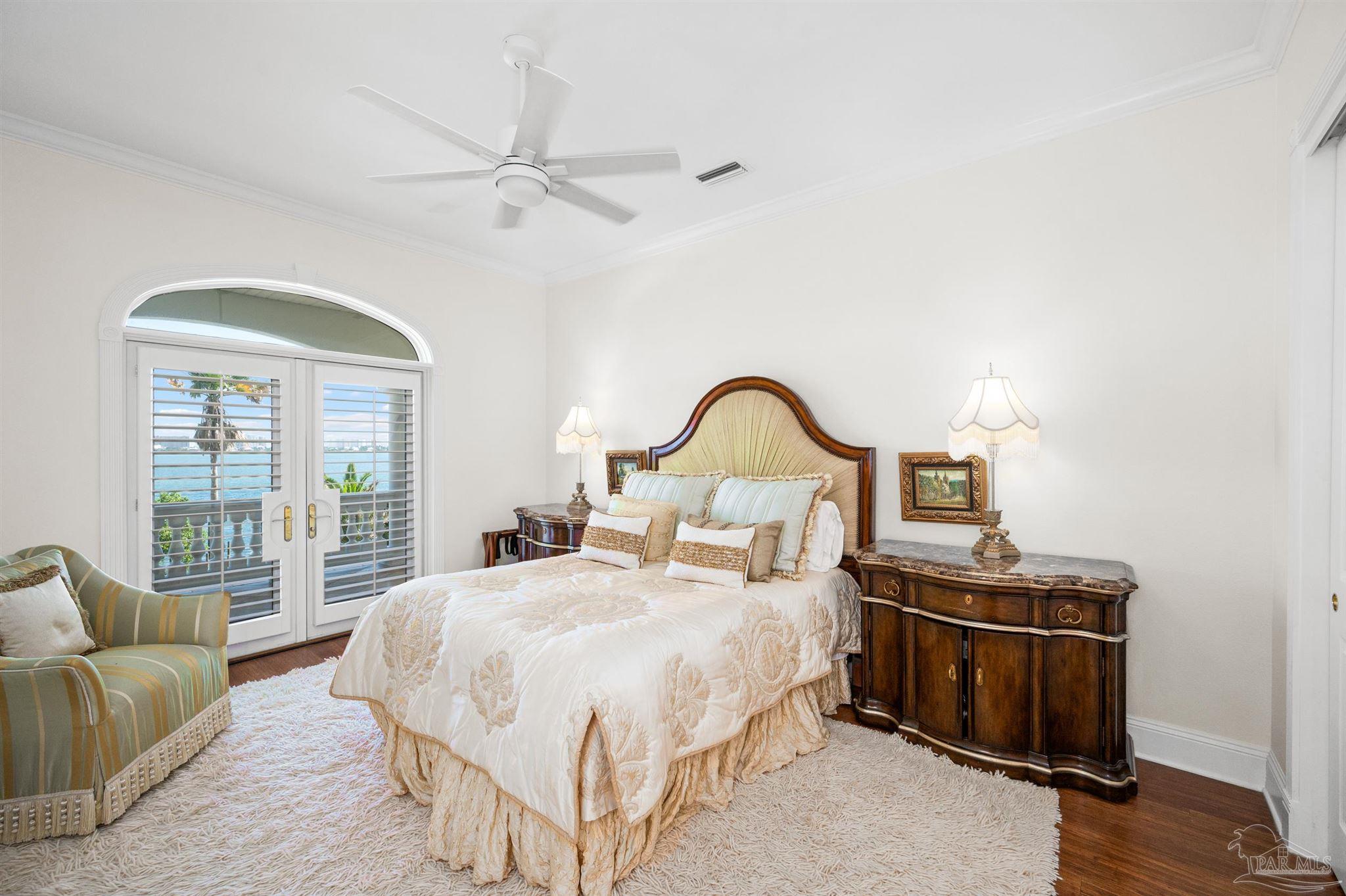 29416 Canal Road Orange Beach, AL 36561 - Photo 34 of 50 a bedroom with a bed and a window