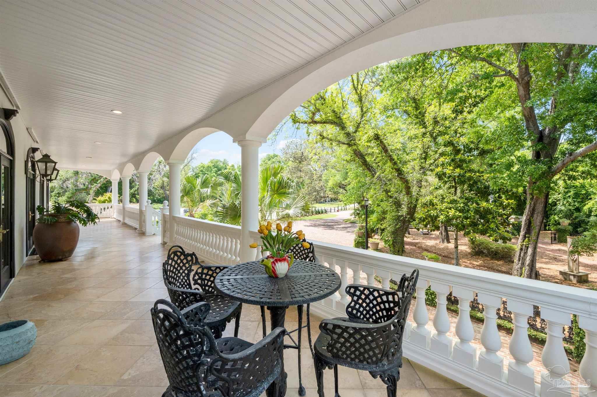 29416 Canal Road Orange Beach, AL 36561 - Photo 39 of 50 a view of a patio with a table chairs and a table