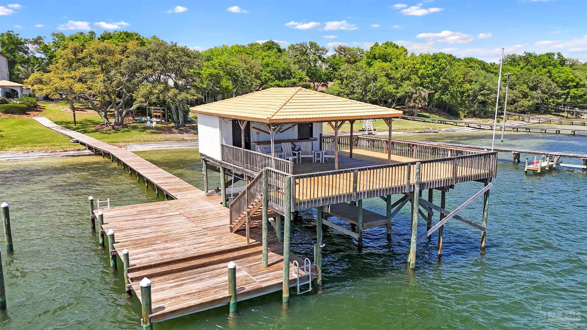 29416 Canal Road Orange Beach, AL 36561 - Photo 45 of 50 a view of a swimming pool with a patio