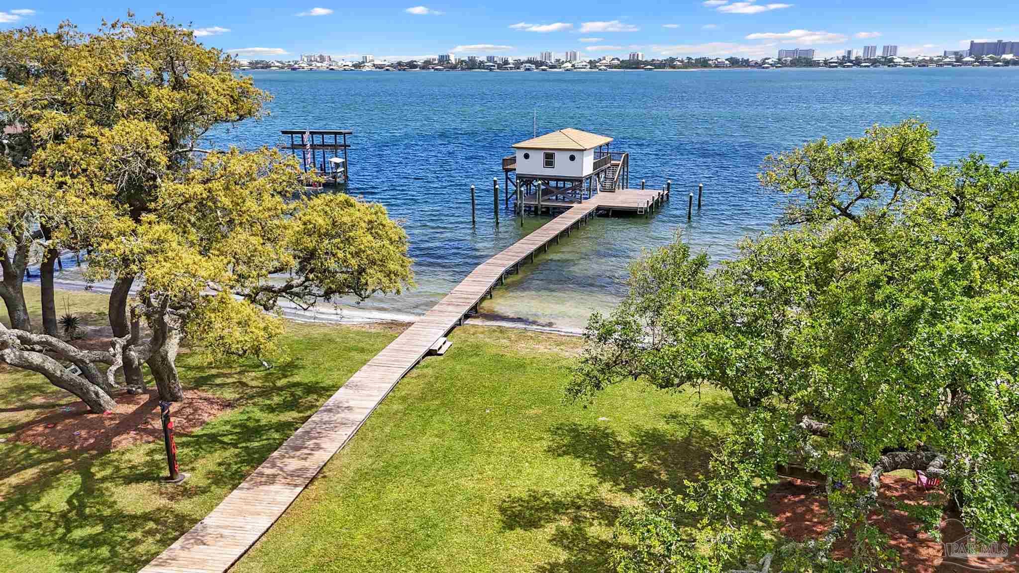 29416 Canal Road Orange Beach, AL 36561 - Photo 46 of 50 a view of a swimming pool with a lake view