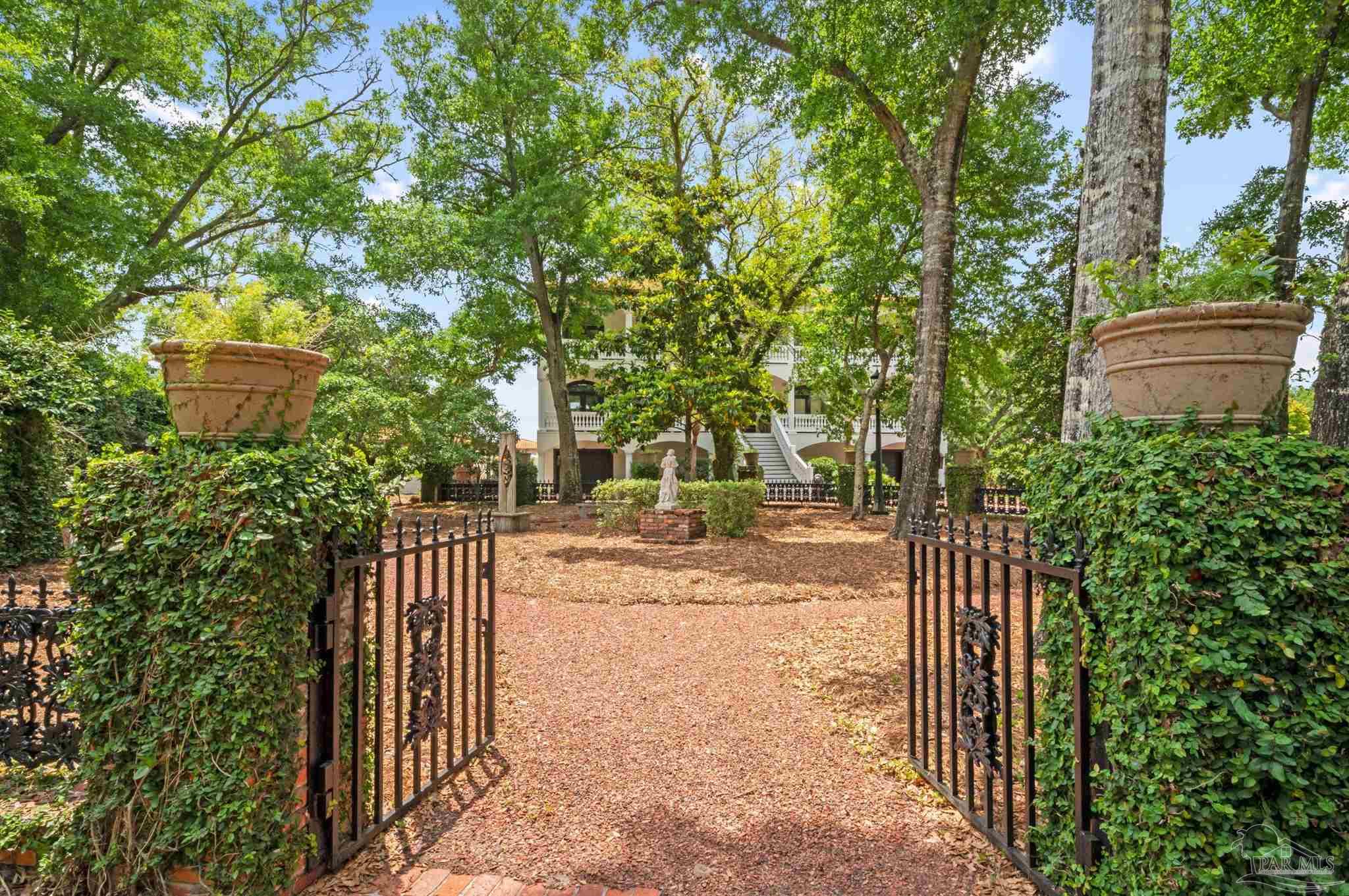 29416 Canal Road Orange Beach, AL 36561 - Photo 49 of 50 a view of a pathway of a house with large trees