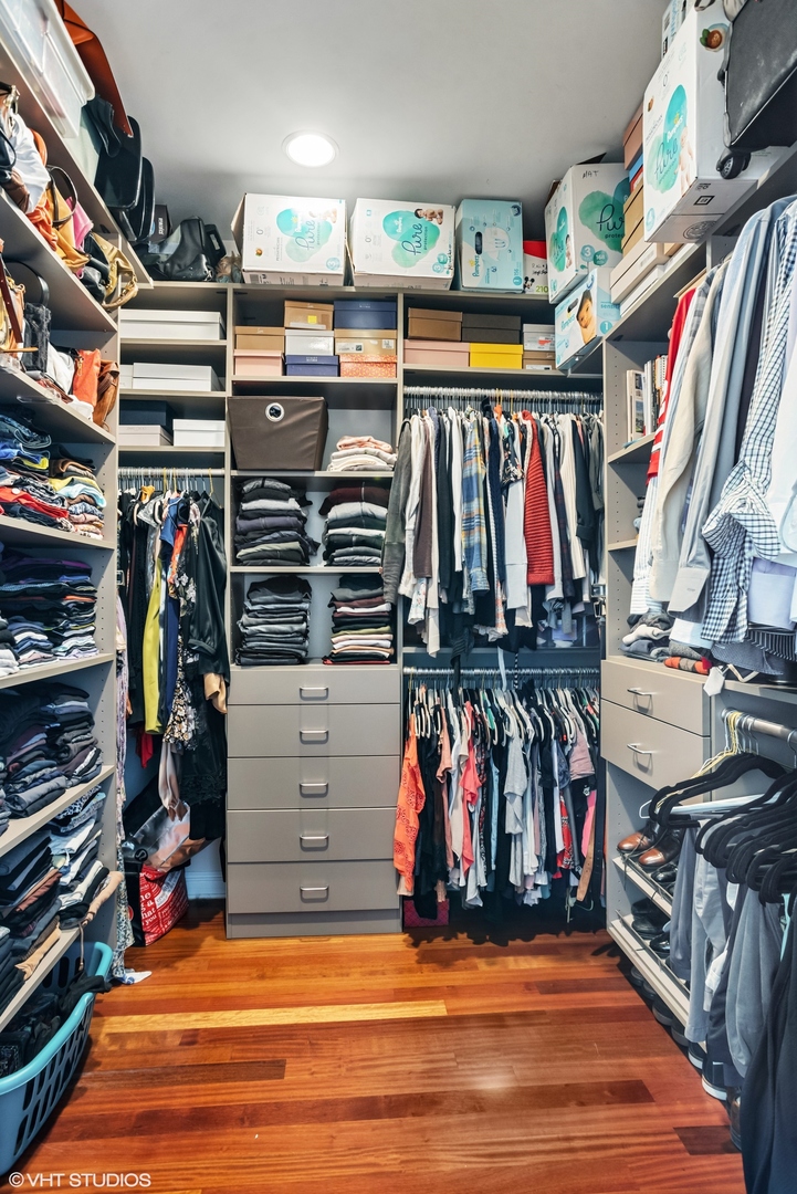 1411 West Chicago Avenue, Unit 3 Chicago, IL 60642 - Photo 11 of 19 a view of walk in closet with clothes and shoes