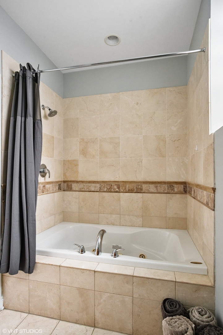1411 West Chicago Avenue, Unit 3 Chicago, IL 60642 - Photo 16 of 19 a bathroom with a shower and a tub