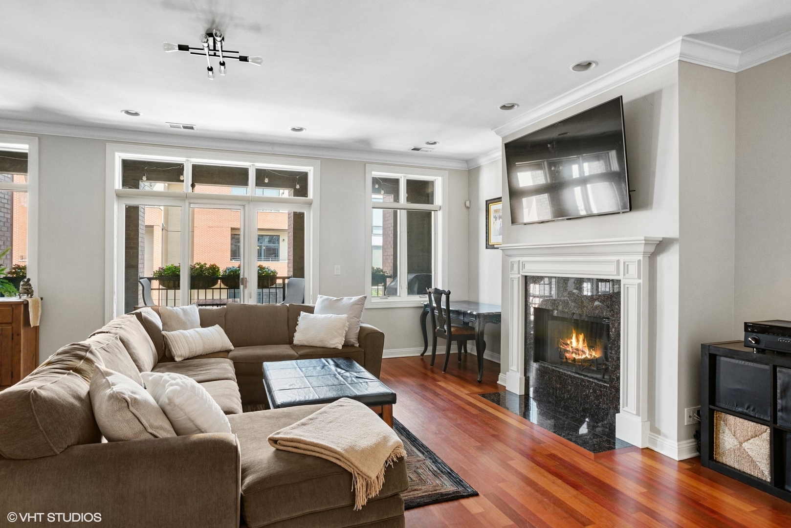 1411 West Chicago Avenue, Unit 3 Chicago, IL 60642 - Photo 3 of 19 a living room with furniture and a fireplace