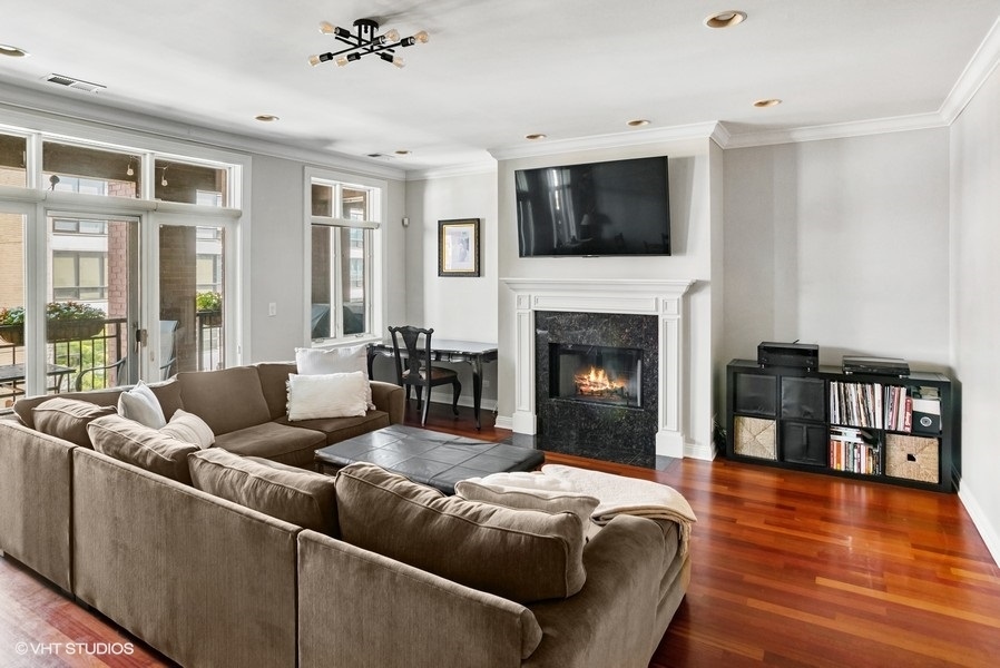 1411 West Chicago Avenue, Unit 3 Chicago, IL 60642 - Photo 4 of 19 a living room with furniture fireplace and flat screen tv