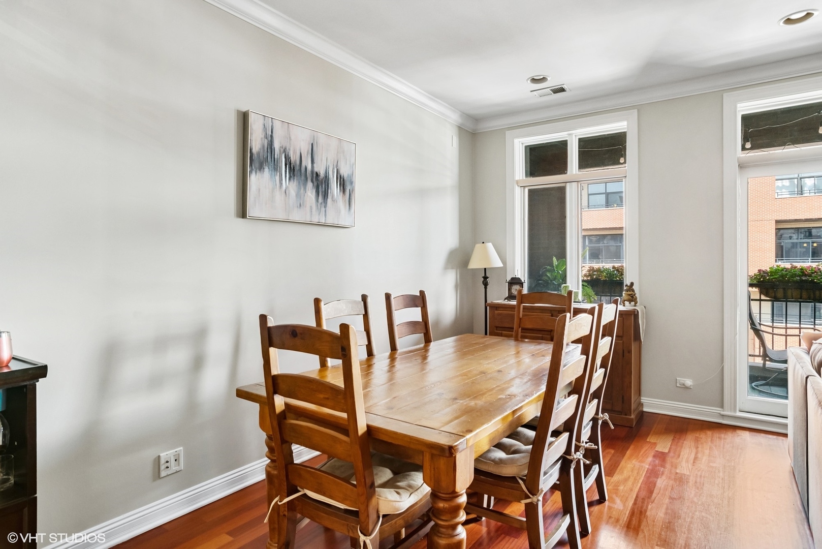1411 West Chicago Avenue, Unit 3 Chicago, IL 60642 - Photo 5 of 19 a view of a dining room with furniture and wooden floor