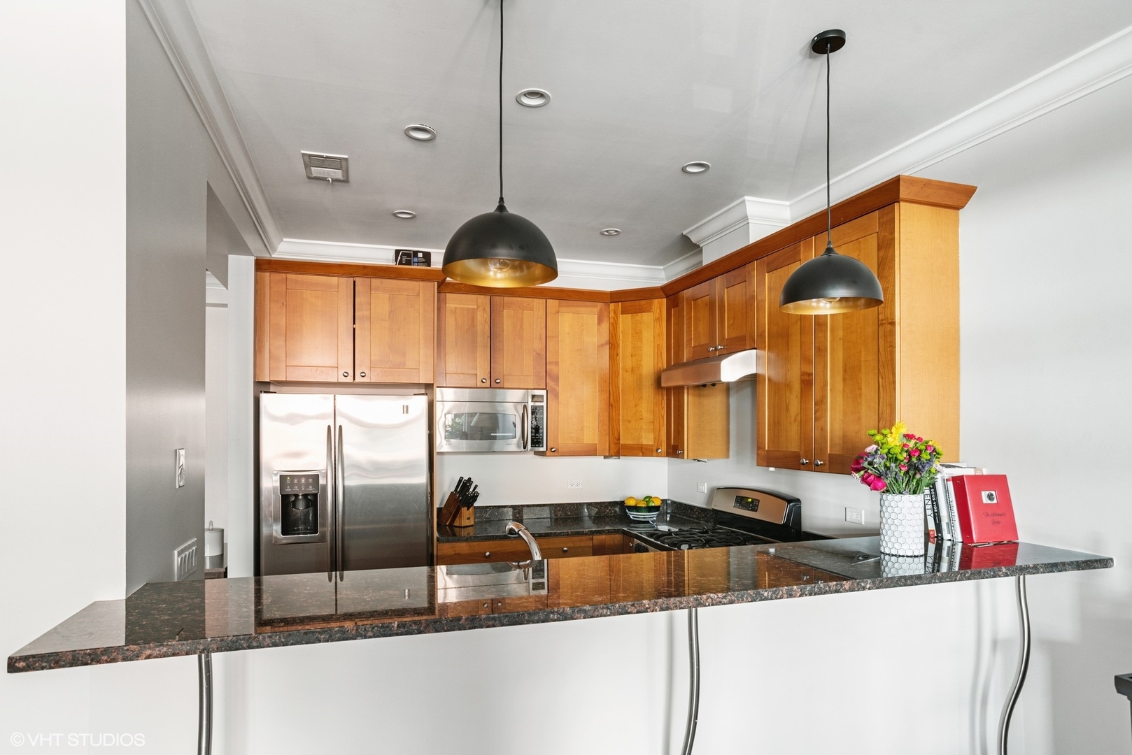 1411 West Chicago Avenue, Unit 3 Chicago, IL 60642 - Photo 6 of 19 a kitchen with granite countertop a sink and a large mirror
