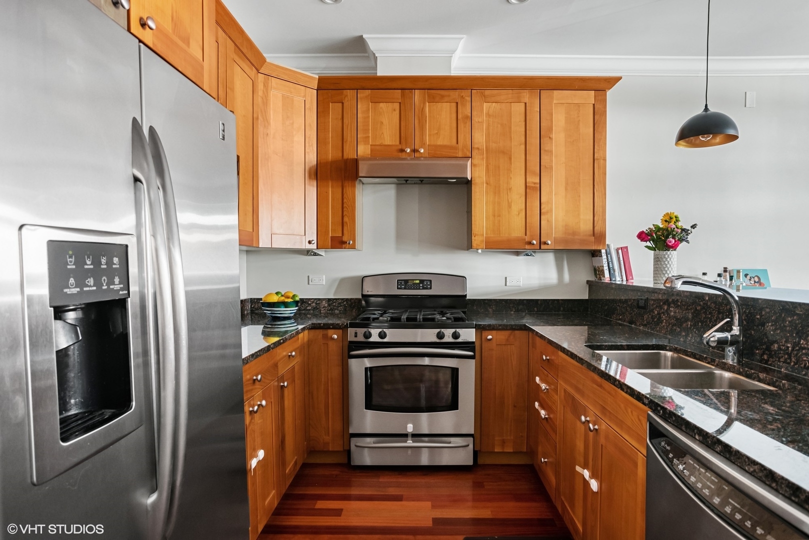1411 West Chicago Avenue, Unit 3 Chicago, IL 60642 - Photo 7 of 19 a kitchen with stainless steel appliances granite countertop a stove a sink and a refrigerator