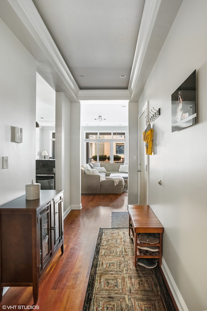1411 West Chicago Avenue, Unit 3 Chicago, IL 60642 - Photo 8 of 19 a living room with furniture and a flat screen tv