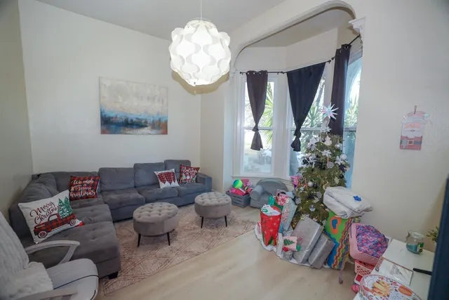 a living room with furniture and a flat screen tv