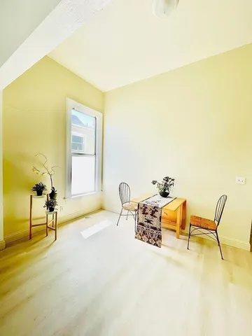 a bathroom with a shower and a sink