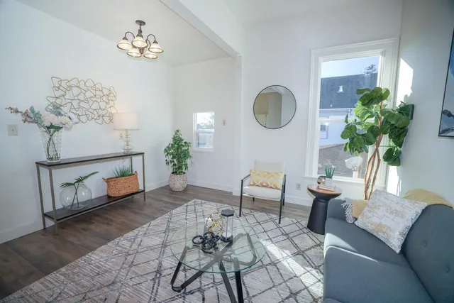 a kitchen with a refrigerator and a sink