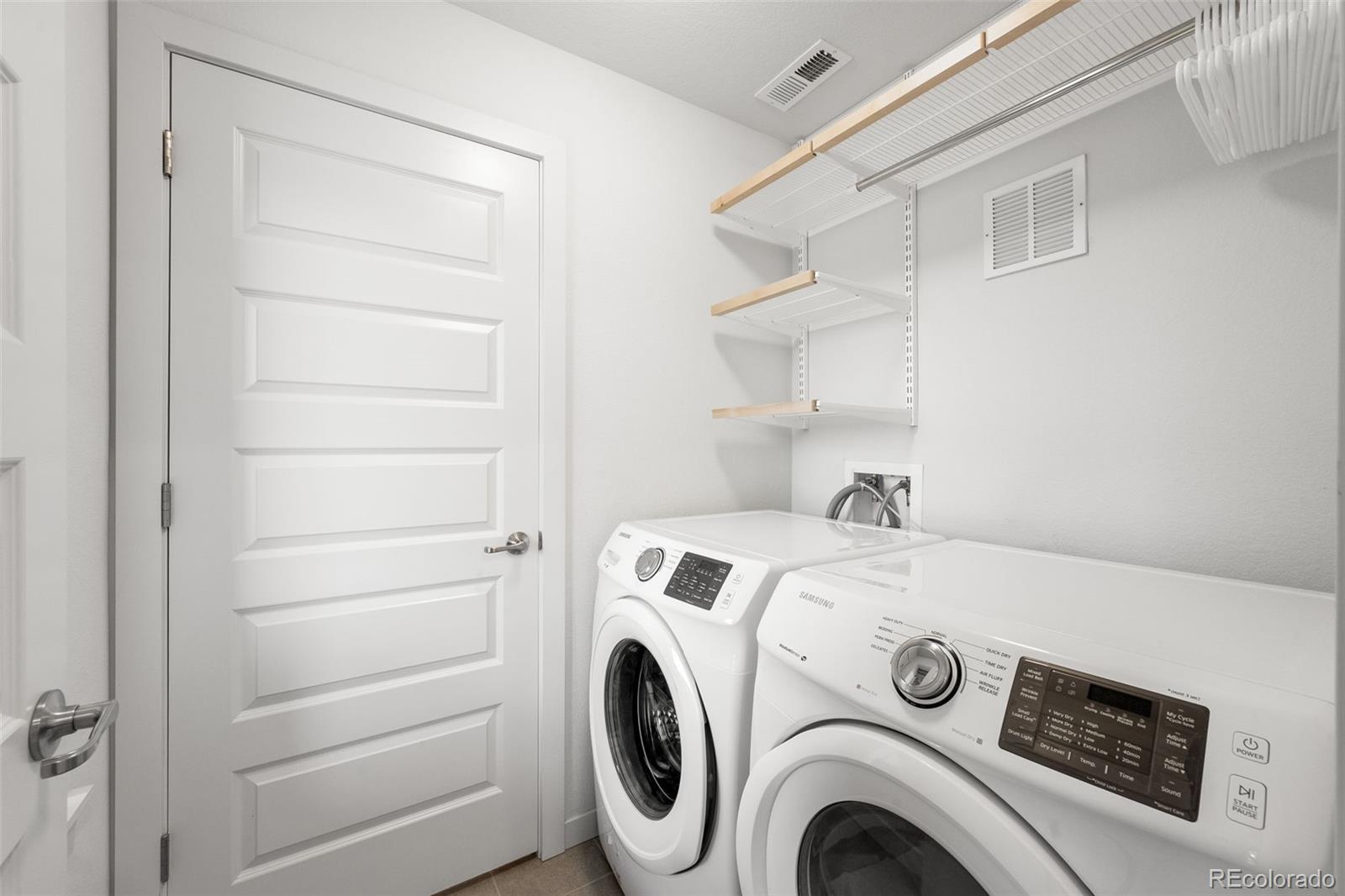 10053 Town Ridge Lane Lone Tree, CO 80124 - Photo 17 of 17 a utility room with dryer and washer