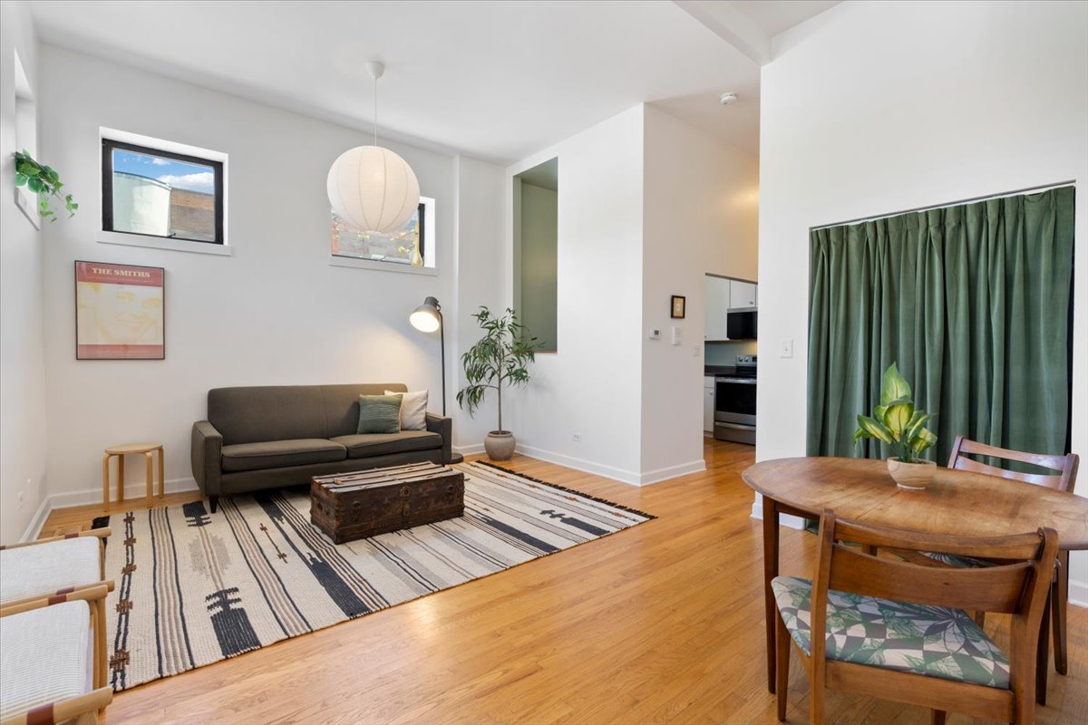 2001 West Ohio Street, Unit 1N Chicago, IL 60612 - Photo 2 of 13 a living room with furniture and a wooden floor