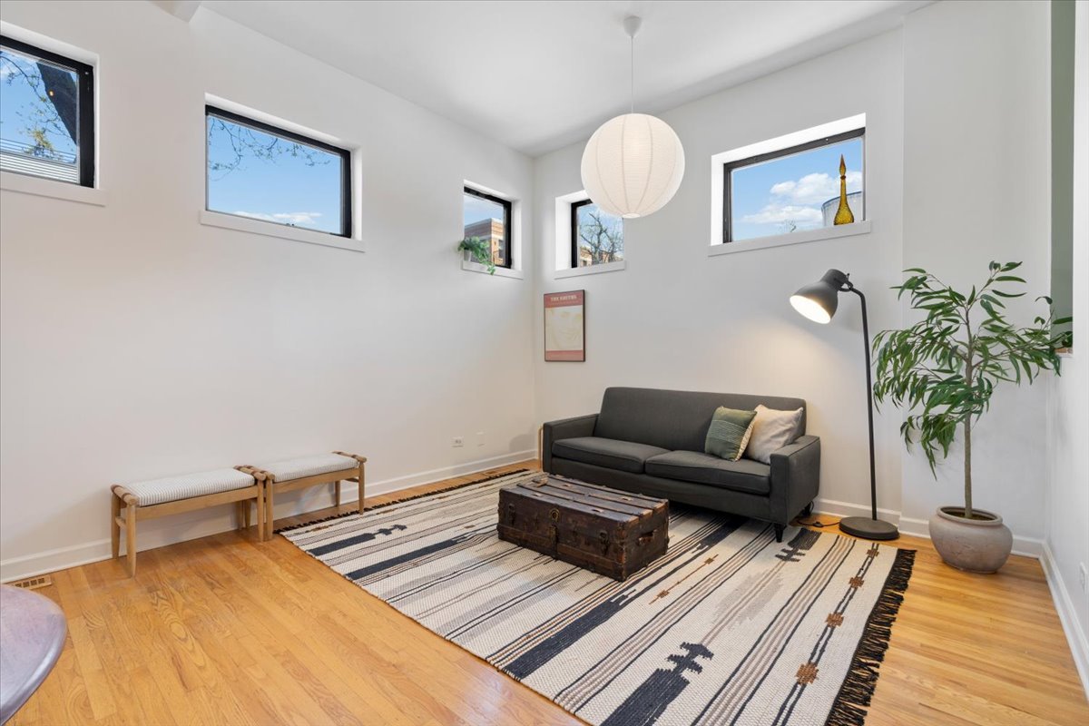 2001 West Ohio Street, Unit 1N Chicago, IL 60612 - Photo 4 of 13 a living room with furniture and a potted plant