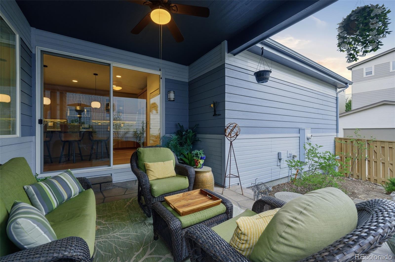 9602 Dunning Circle Highlands Ranch, CO 80126 - Photo 28 of 50 a view of a patio with couches table and chairs and potted plants