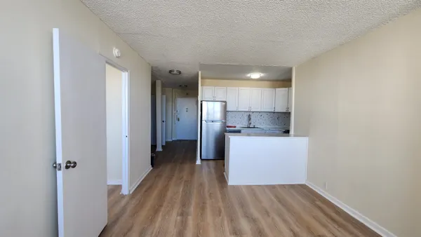 a view of kitchen with wooden floor