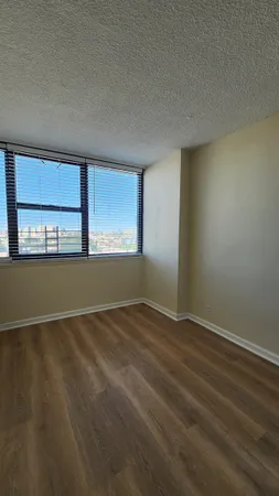 a view of an empty room with a window