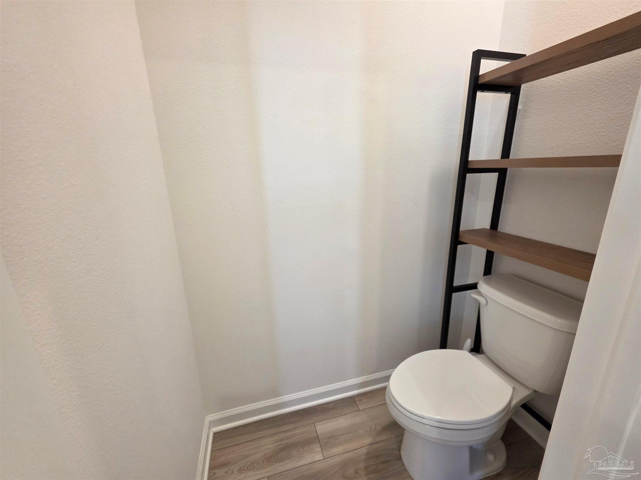 9613 Sagewood Drive Pensacola, FL 32526 - Photo 17 of 27 a white toilet sitting next to a shower