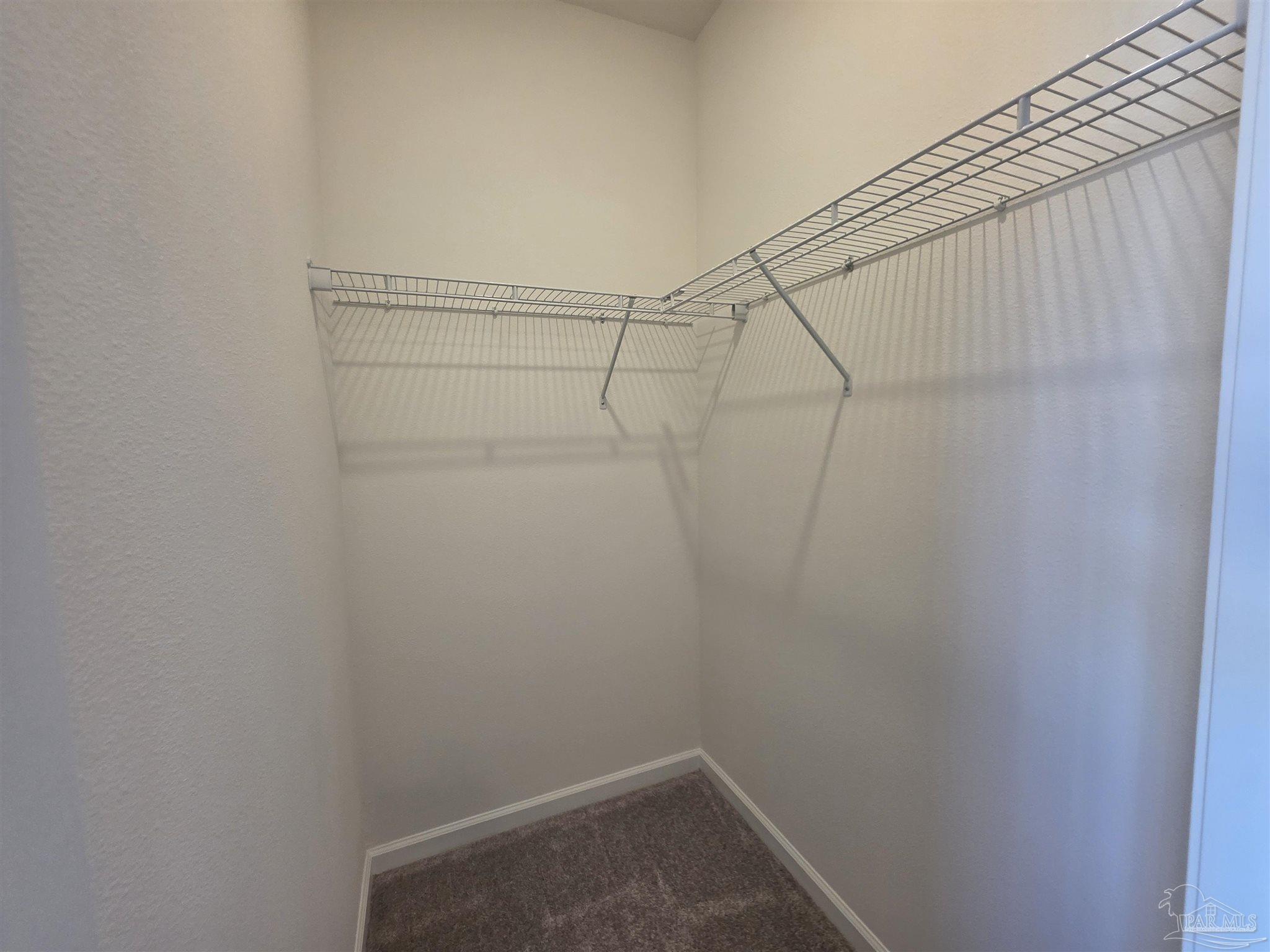 9613 Sagewood Drive Pensacola, FL 32526 - Photo 25 of 27 a view of a room with racks on the wall