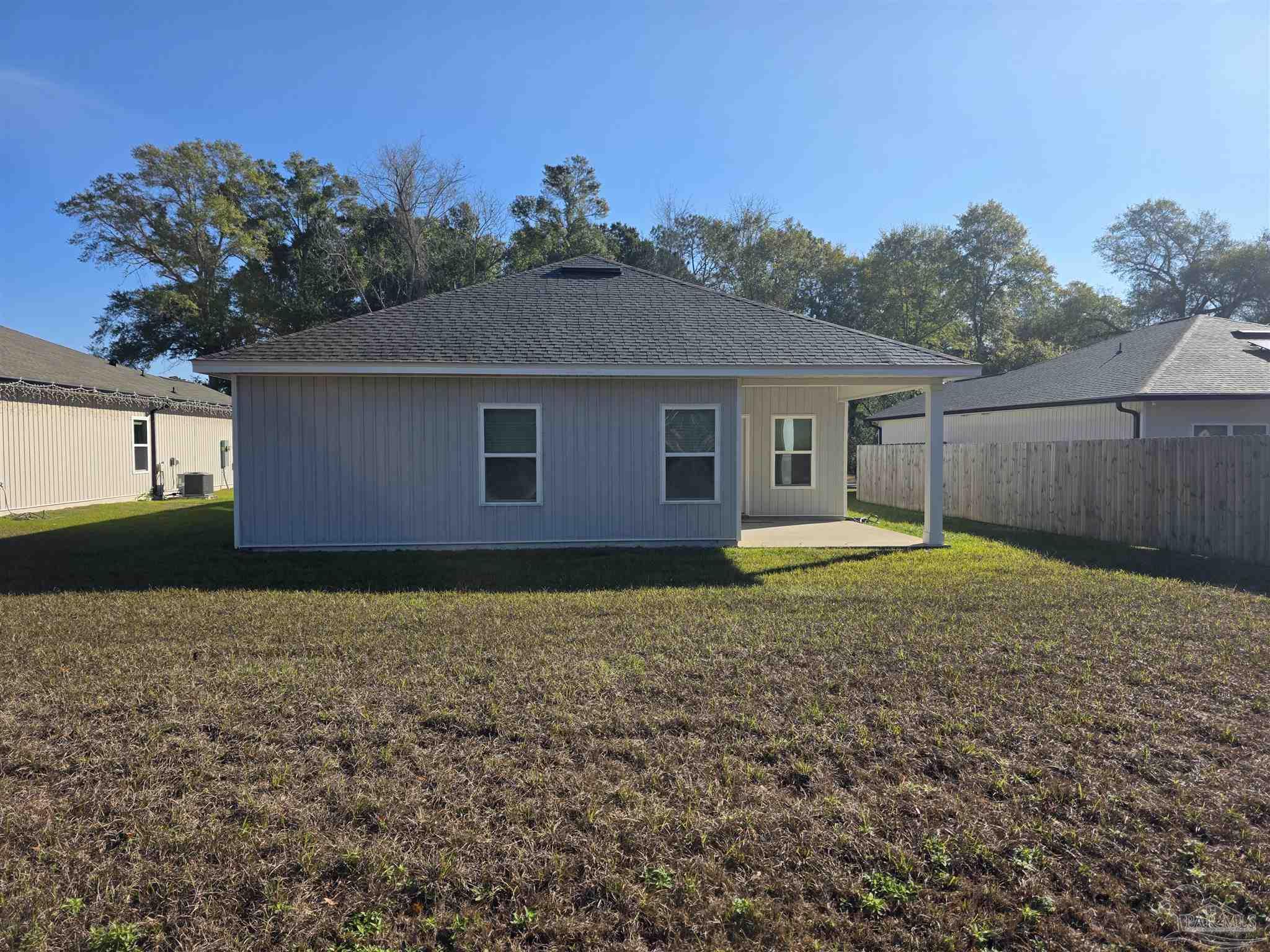 9613 Sagewood Drive Pensacola, FL 32526 - Photo 27 of 27 a view of a house with a yard