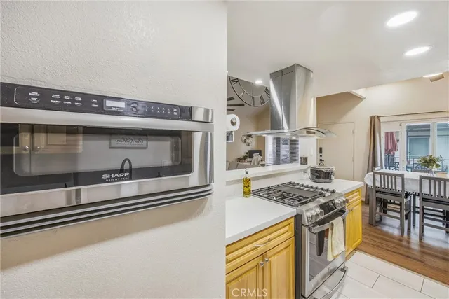 a kitchen with stainless steel appliances granite countertop a stove and a sink