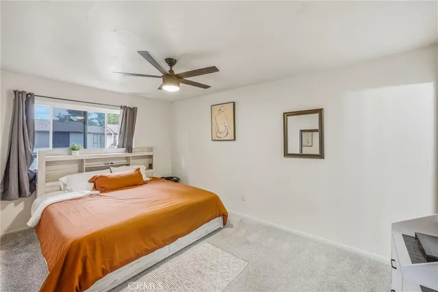 a bedroom with a bed and window