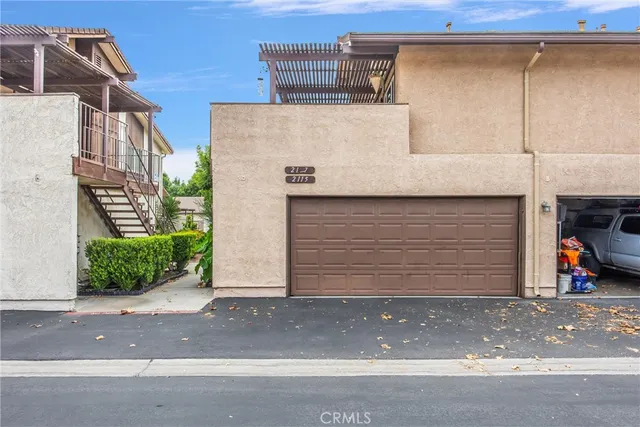 a front view of a house with garage