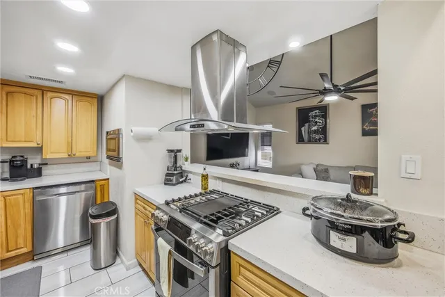 a kitchen with a stove and a sink