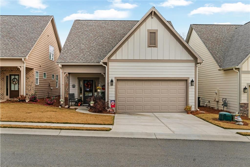 a view of a house with garage and windows