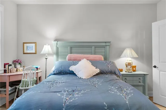 a bedroom with a bed and window