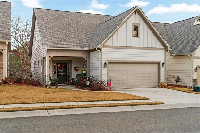 a front view of a house with a garage