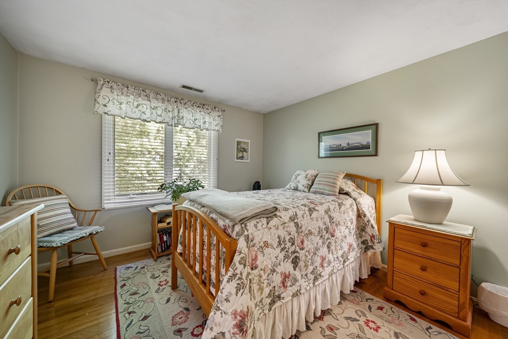 21 Tulip Circle, Unit 21 Haverhill, MA 01830 - Photo 20 of 26 a bedroom with a bed and a window