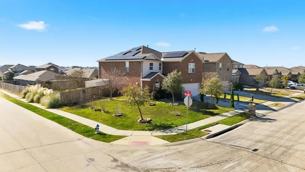 a view of houses with a swimming pool