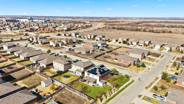 an aerial view of a city with ocean view