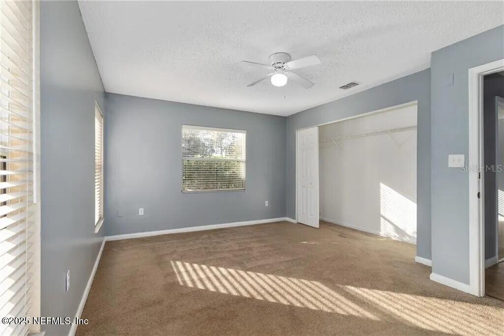 3991 Southeast 19th Avenue Ocala, FL 34480 - Photo 6 of 11 a view of an empty room with a window