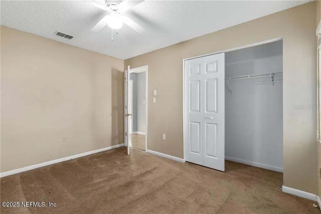 3991 Southeast 19th Avenue Ocala, FL 34480 - Photo 10 of 11 an empty room with windows and closet