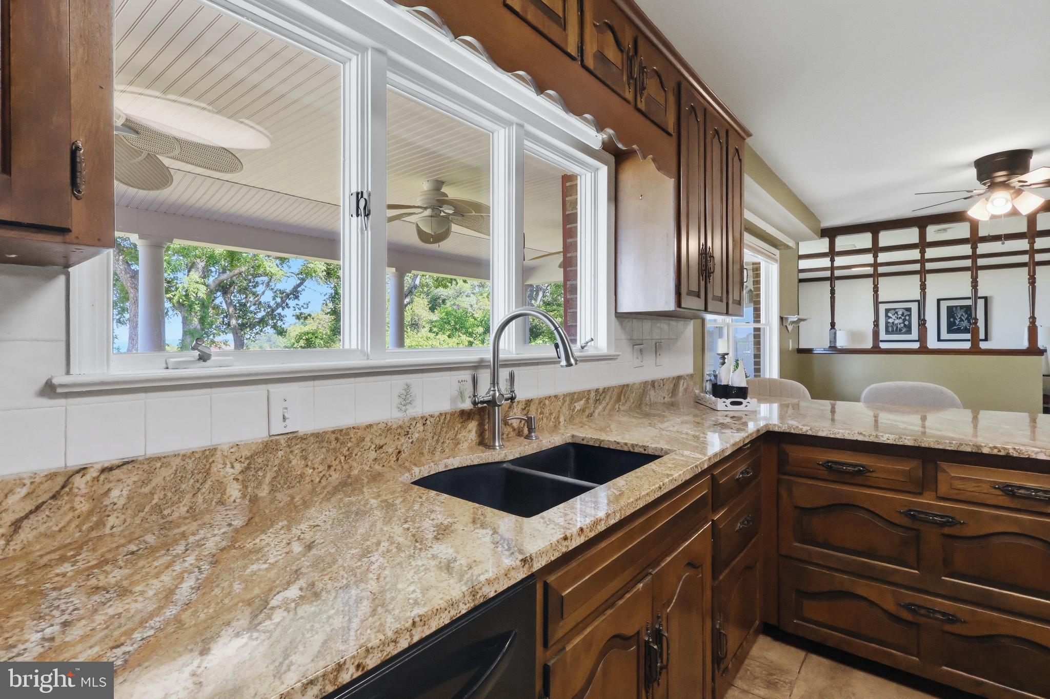 23500 River Road Lexington Park, MD 20653 - Photo 20 of 92 a kitchen with granite countertop a sink and a window