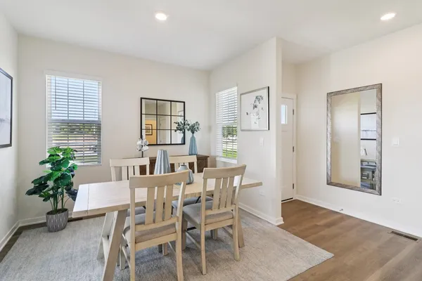 a view of a dining room with furniture and window