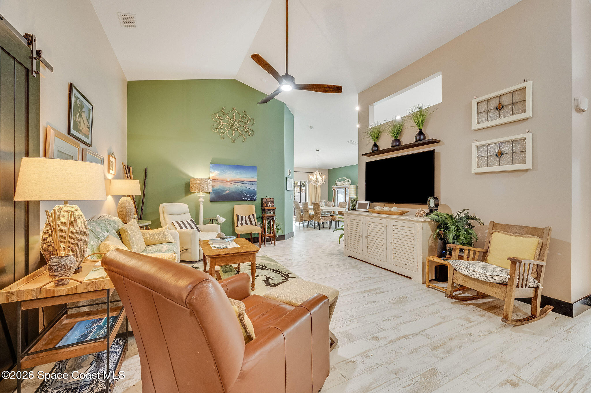 3911 Joslin Way Melbourne, FL 32904 - Photo 14 of 63 a living room with furniture and a flat screen tv