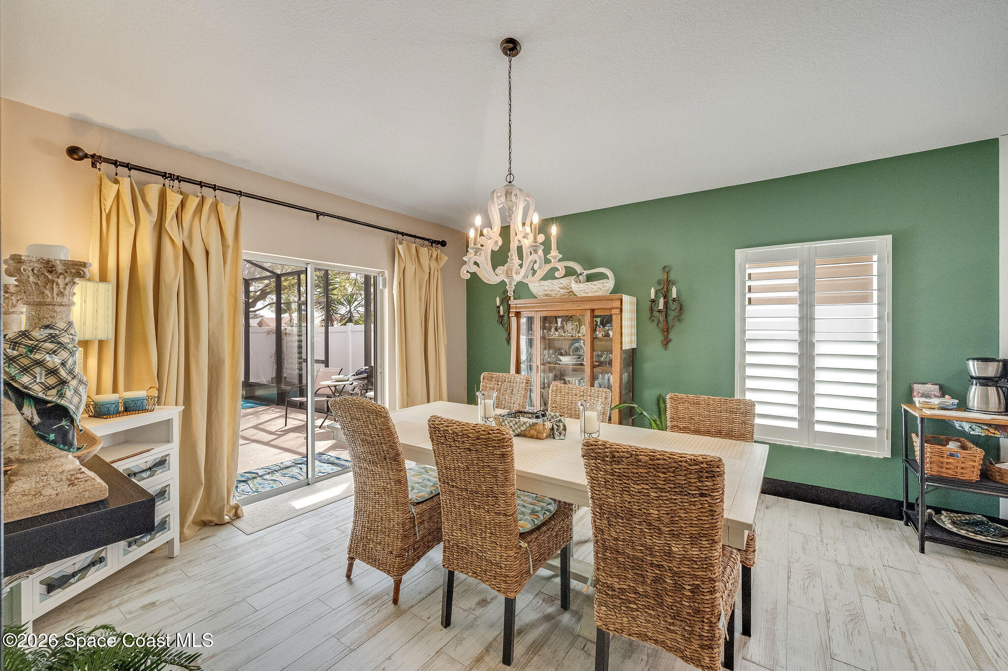 3911 Joslin Way Melbourne, FL 32904 - Photo 17 of 63 a view of a dining room with furniture window and wooden floor
