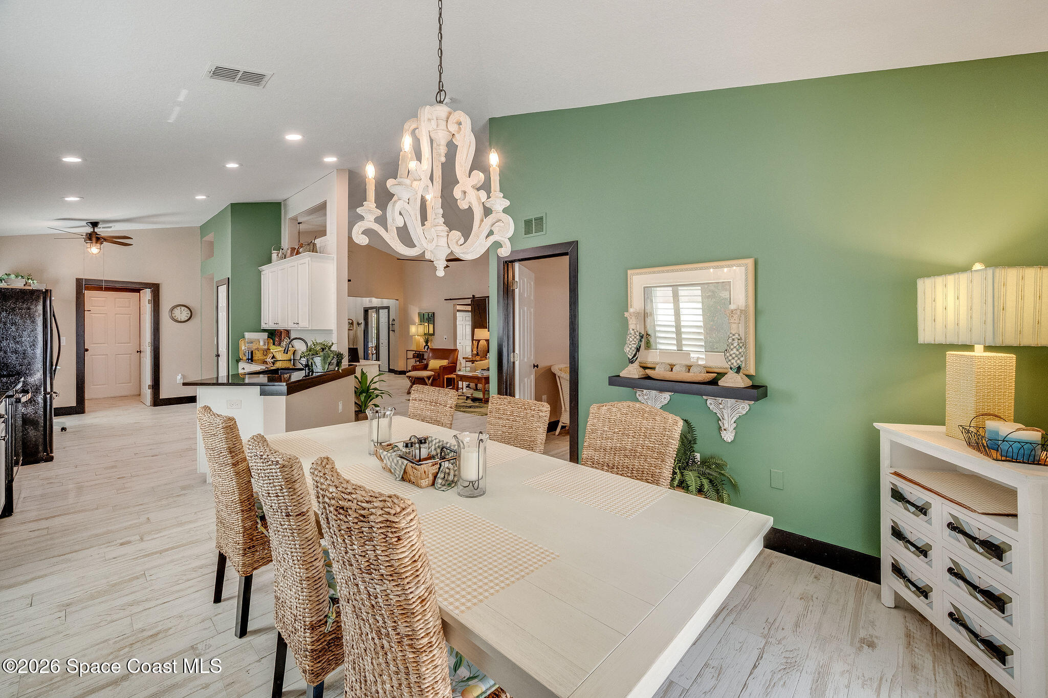 3911 Joslin Way Melbourne, FL 32904 - Photo 19 of 63 a view of a dining room with furniture and wooden floor