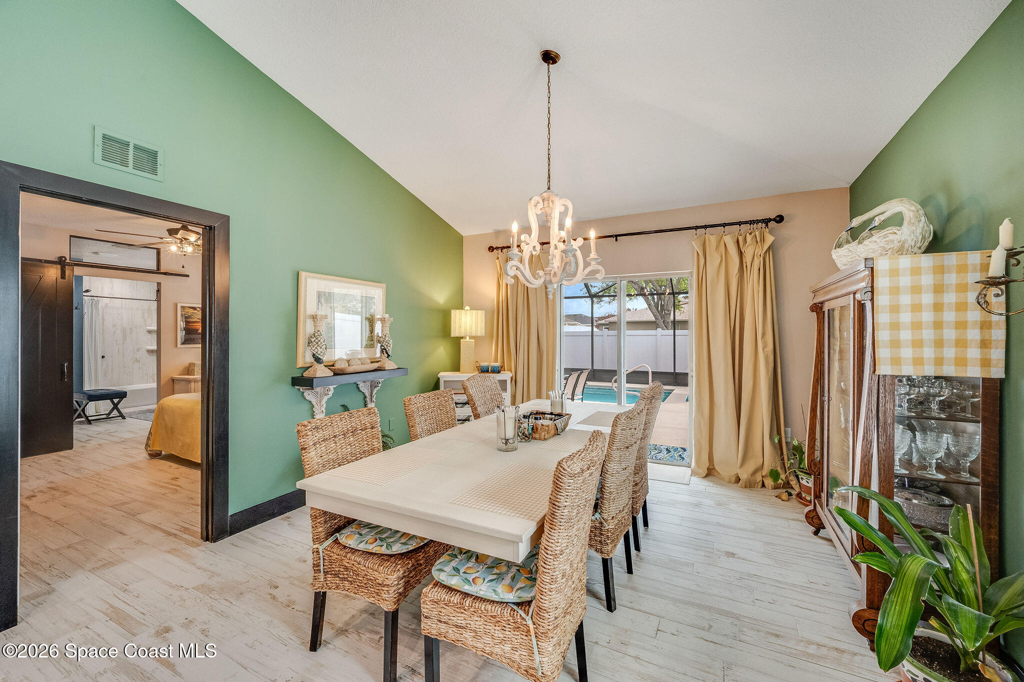 3911 Joslin Way Melbourne, FL 32904 - Photo 20 of 63 a view of a dining room with furniture window and wooden floor