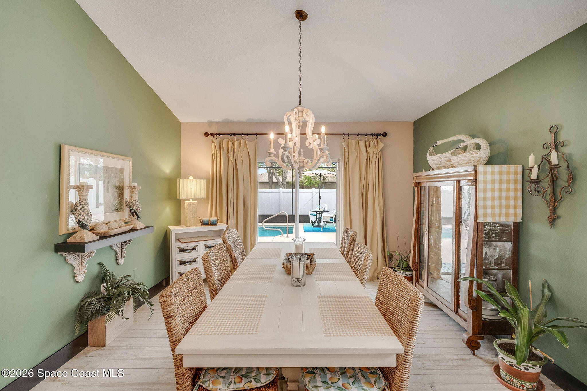 3911 Joslin Way Melbourne, FL 32904 - Photo 21 of 63 a dining room with furniture window wooden floor