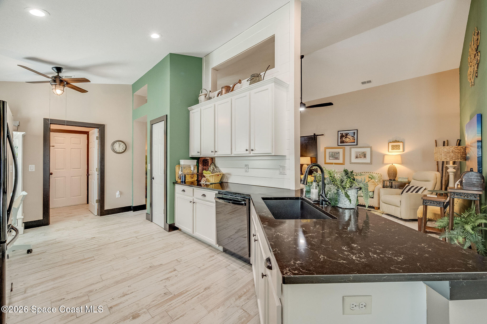3911 Joslin Way Melbourne, FL 32904 - Photo 26 of 63 a kitchen with stainless steel appliances granite countertop a sink dishwasher stove and refrigerator